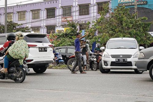 Dimana-mana Ada Pak Ogah, Dishub Pekanbaru: Harusnya Masyarakat Juga Patuh Dong